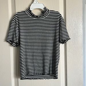 Black/white crop top with lettuce-style turtleneck, sleeves, and bottom.